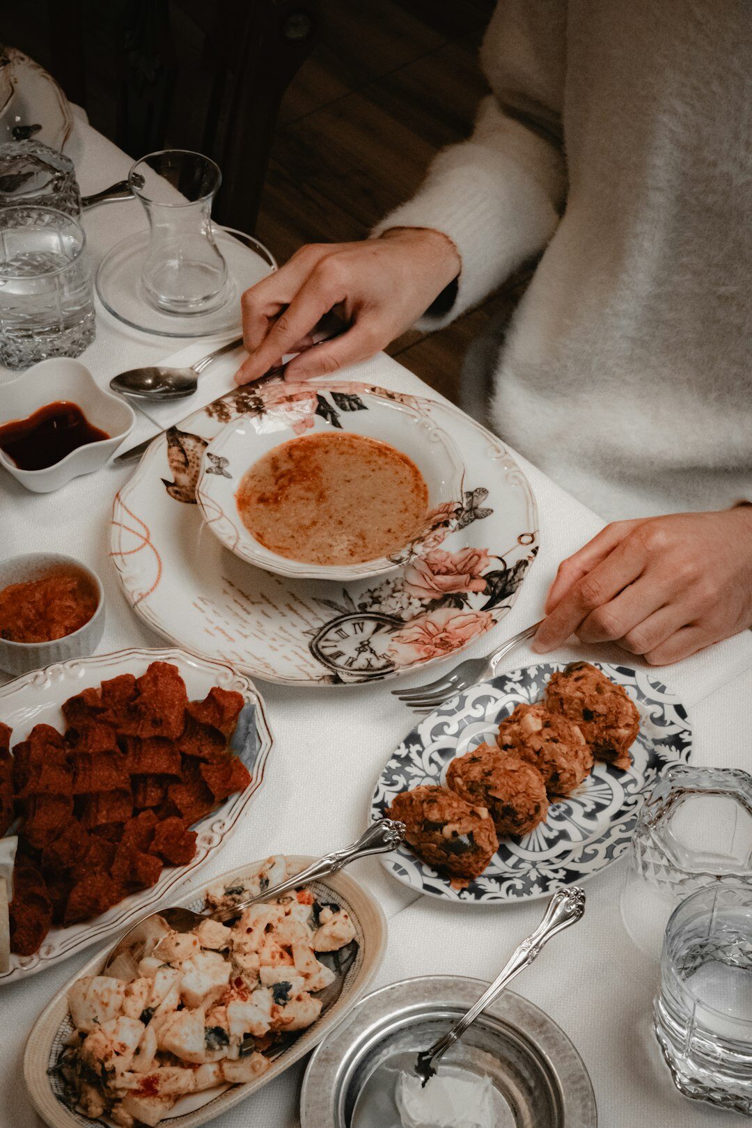 Traditional Czech Sunday lunch spread on a rustic wooden table with roast meat, dumplings and gravy